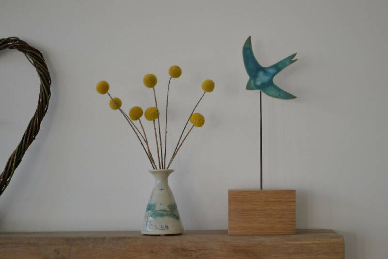 Single Swift - A beautiful turquoise ceramic swift mounted on a wooden block
